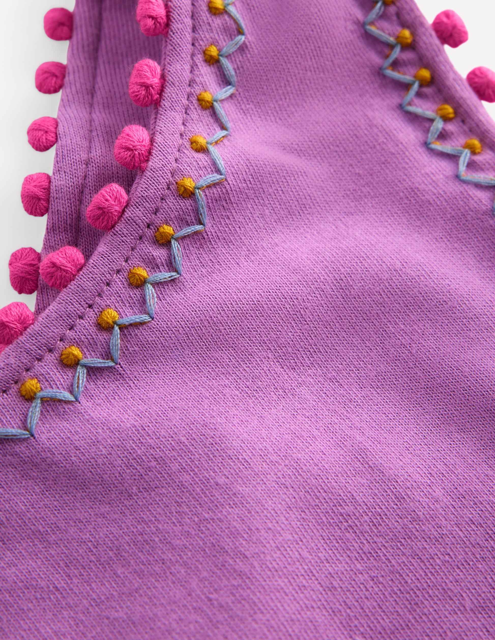Oberteil mit überkreuzten Rückenträgern und Bommelbesatz-Kreideviolett-3
